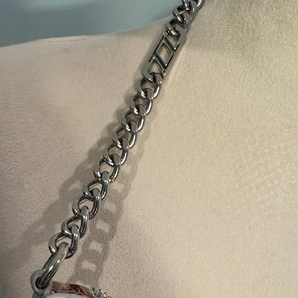 Aldo quilted silver Shoulder Bag with silver chain.